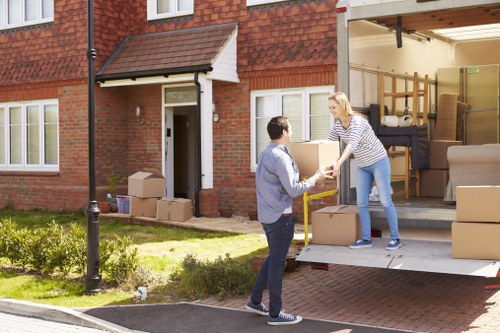 Office removals planning in Bromley with moving boxes and workspace equipment
