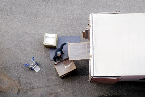 Commercial office move with desks, chairs, and boxes arranged for transport