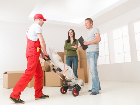 A Bromley moving team preparing fragile items for safe transport